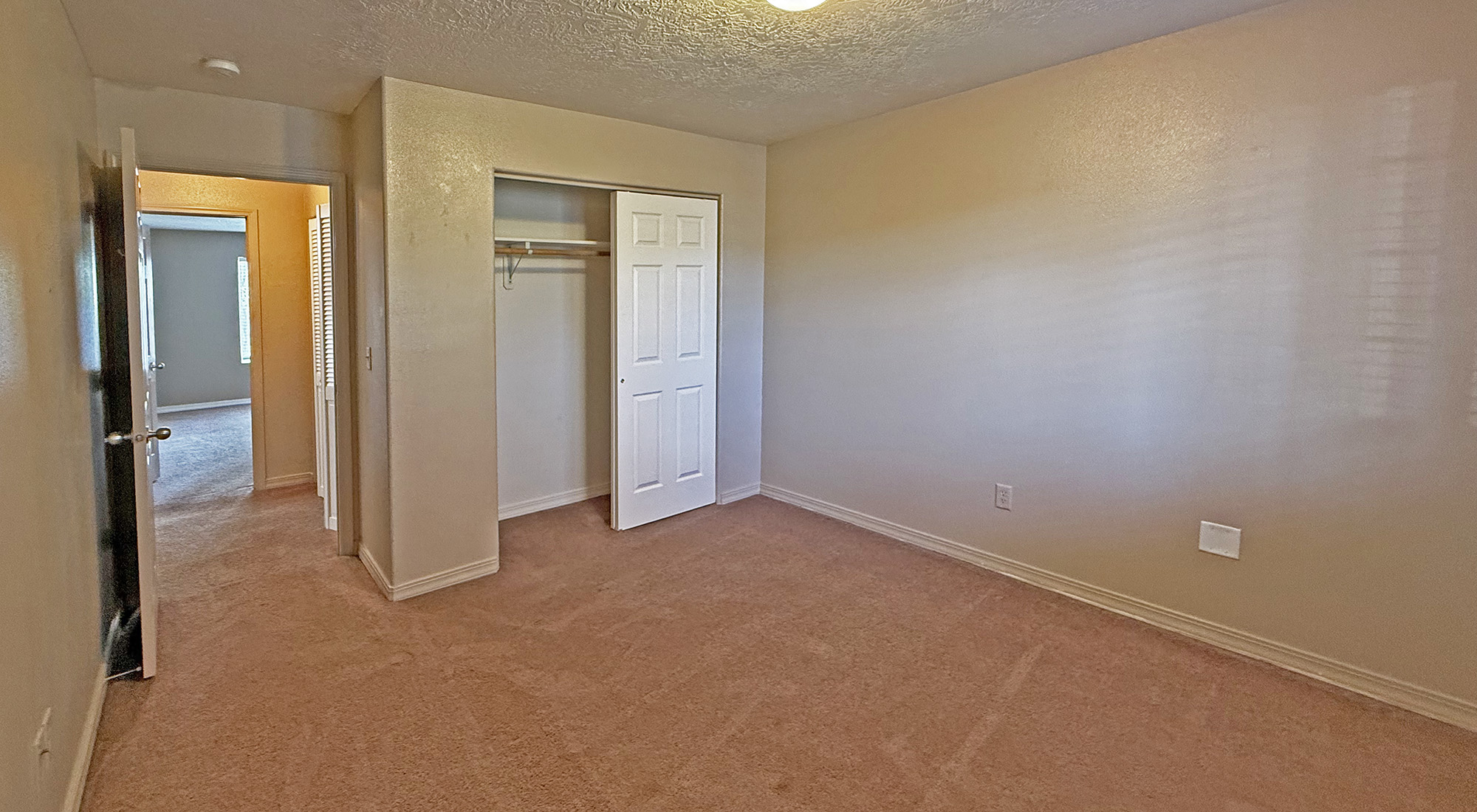 Second bedroom view toward hallway and master bedroom